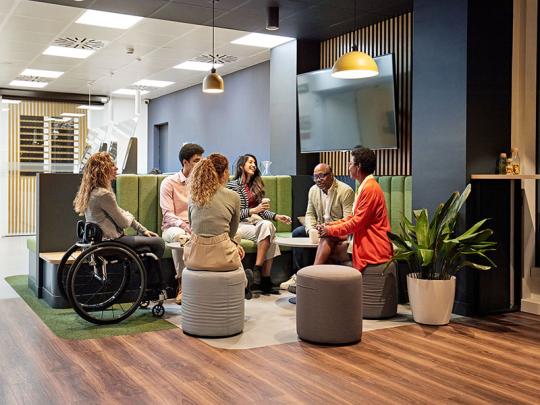 office staff gathered together and talking