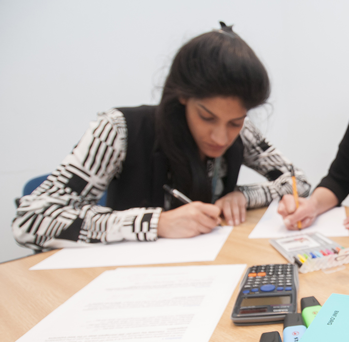 pharmacy-staff-writing at a table